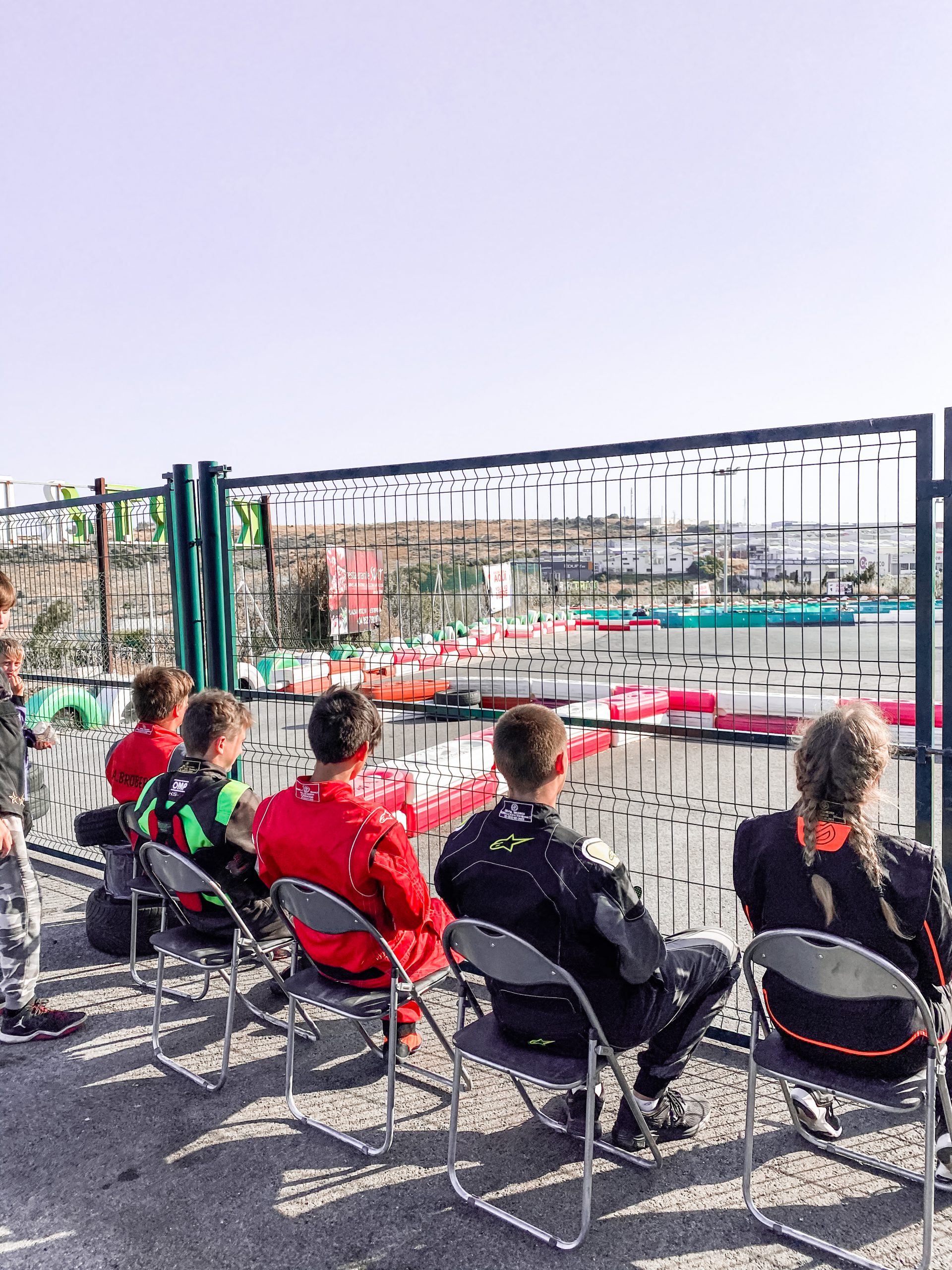 sitting children looking at track